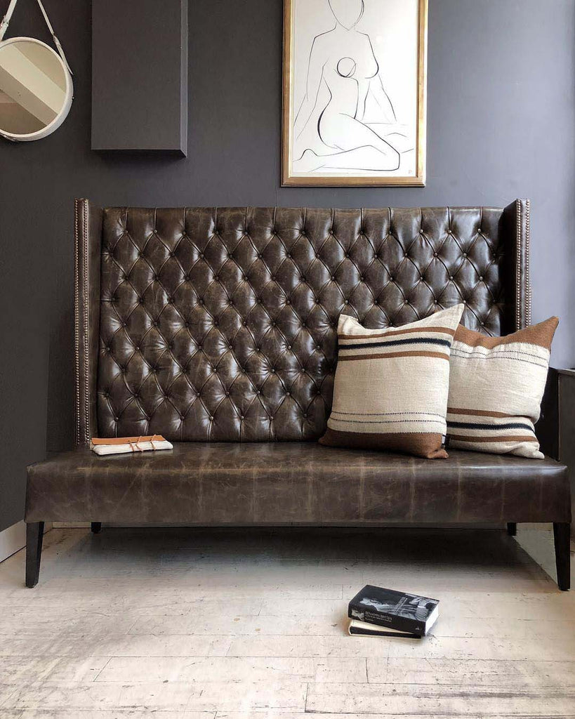 Highback bench with pillows and book