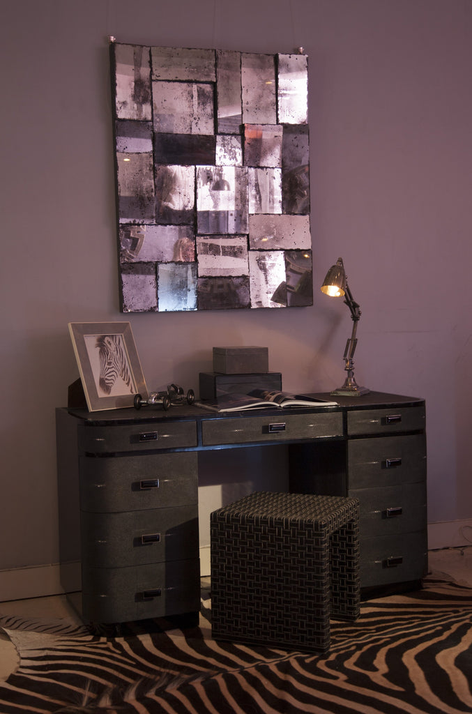 Deco Desk in moody shot with mirror, zebra rug and lmaps