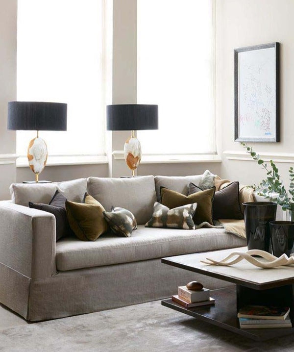 Arca Horn Oval lamps behind sofa