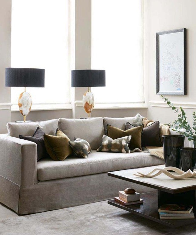Arca Horn Oval lamps behind sofa