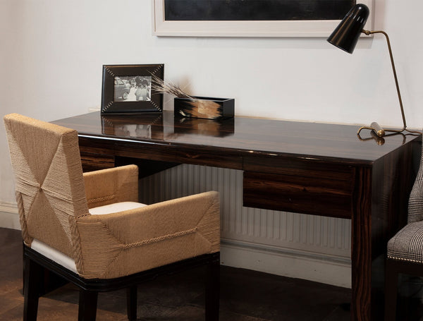 Paix table lamp on ebony desk