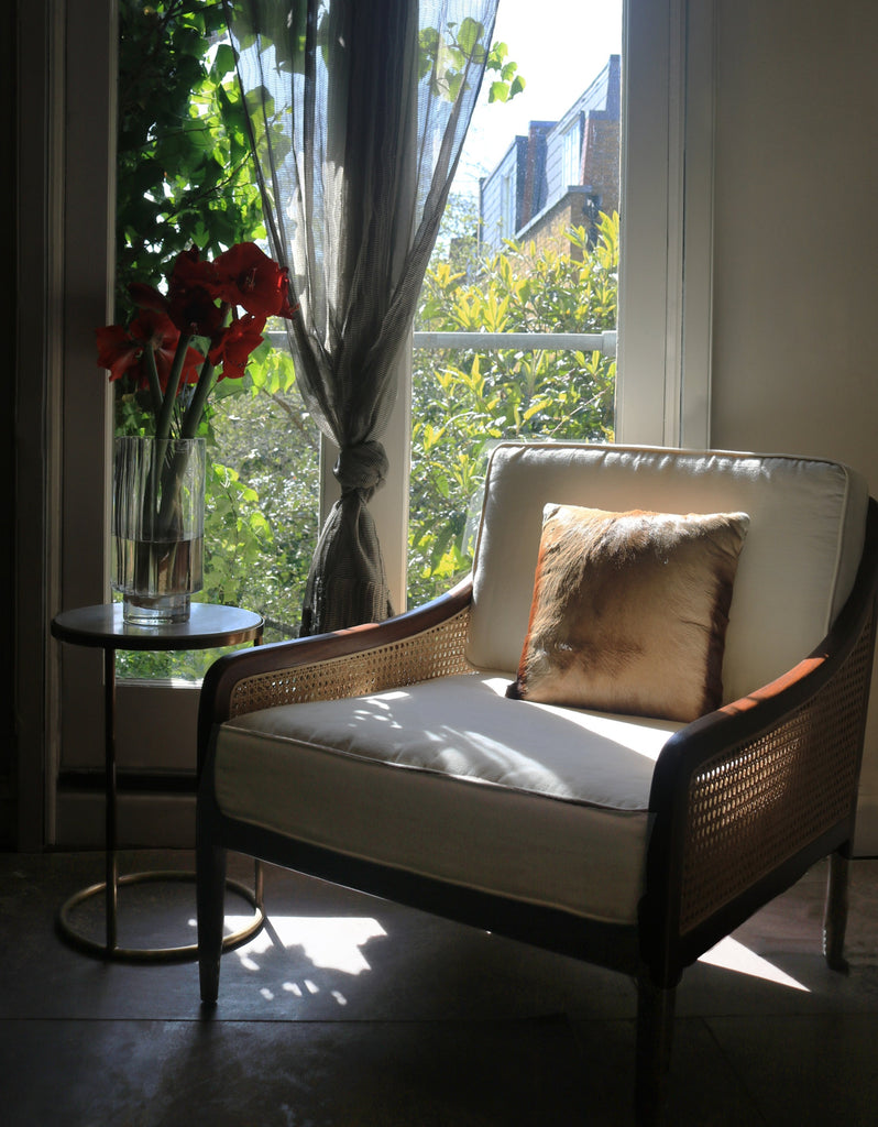 Safari Armchair in window with flowers