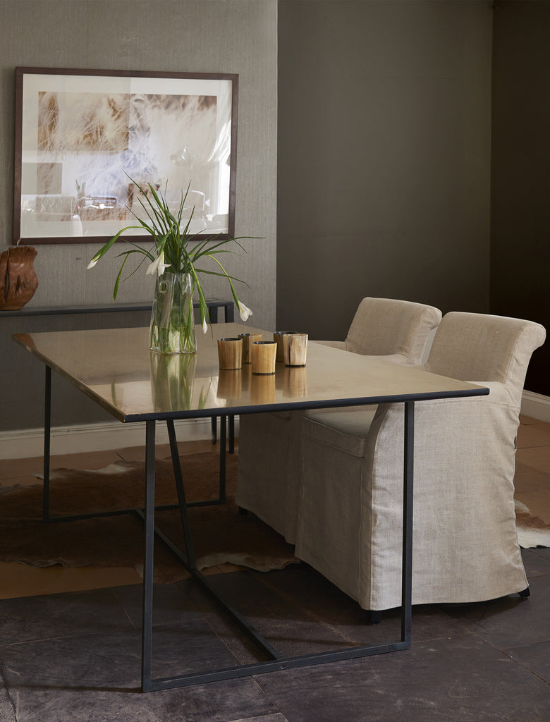 Loose cover dining chair with brass table