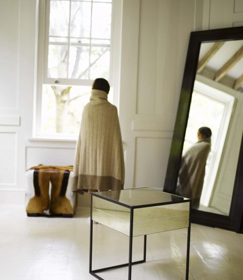 Springbok Hide Stool next to girl with decor