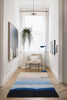 Mohair Rug in Hallway with paintings and chair