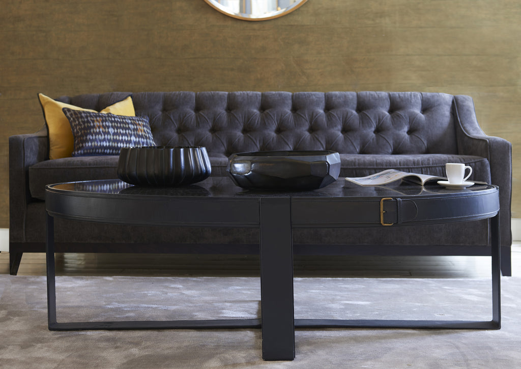 Camera Leather Buckle Oval Coffee table shown in living room